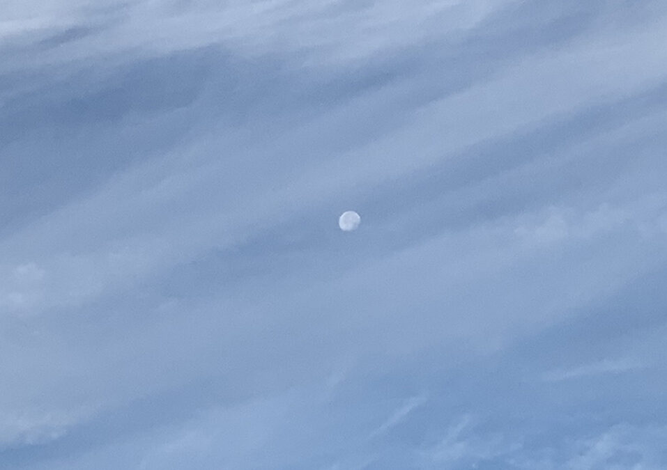 Moon in daytime with clouds